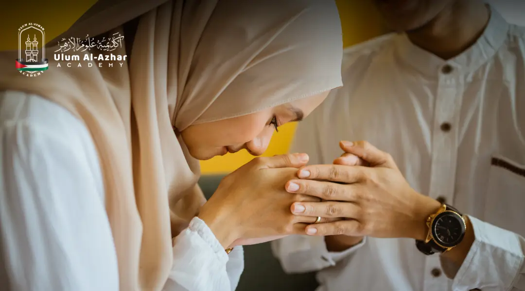 A Muslim woman kisses her husband’s hand in gratitude during Ramadan, explaining: Does Kissing Break Your Fast?